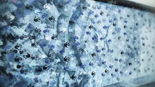 BerlinWallBlueHands